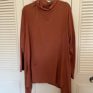 Burnt orange turtleneck long sleeve tunic with shark bite hem